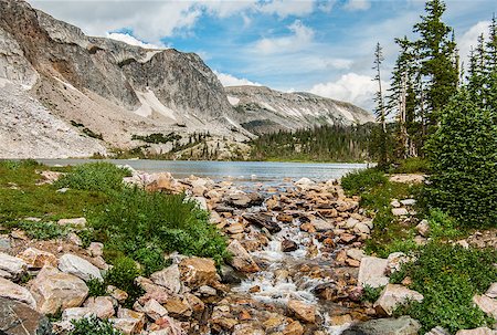 A small stream carries overflowing water from a mountain lake in southern Wyoming. Fotografie stock - Microstock e Abbonamento, Codice: 400-07754067