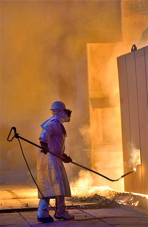 simsearch:400-07754466,k - A steel worker takes a sample of hot steel Foto de stock - Royalty-Free Super Valor e Assinatura, Número: 400-07754466