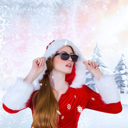 simsearch:400-07755560,k - Cool santa girl wearing sunglasses against snowy landscape with fir trees Stock Photo - Budget Royalty-Free & Subscription, Code: 400-07755560