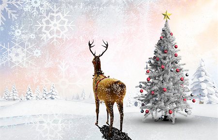 simsearch:400-07755560,k - Composite image of christmas tree and reindeer against snowy landscape with fir trees Stock Photo - Budget Royalty-Free & Subscription, Code: 400-07755779