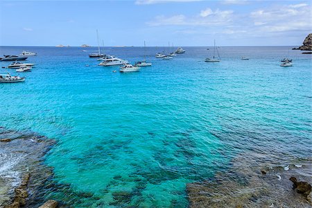 simsearch:400-05704788,k - Summer time. Sailboats in the mediterranean turquoise waters of Ibiza island Fotografie stock - Microstock e Abbonamento, Codice: 400-07755865