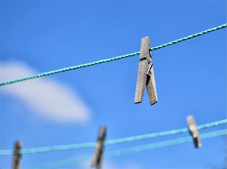 clothespins on rope and blue sky as background Stock Photo - Budget Royalty-Free & Subscription, Code: 400-07756623