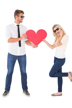 simsearch:400-07686534,k - Young man giving woman red heart over white background Foto de stock - Royalty-Free Super Valor e Assinatura, Número: 400-07750574