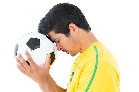 simsearch:400-07624970,k - Side view of a tensed football player over white background Foto de stock - Super Valor sin royalties y Suscripción, Código: 400-07750610