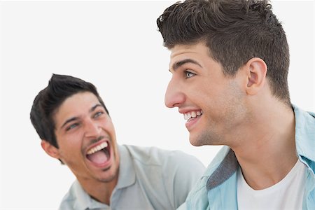 sports fan watching a game on tv - Side view of two excited soccer fans over white background Stock Photo - Budget Royalty-Free & Subscription, Code: 400-07750637