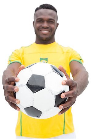 Portrait of Brazilian football player standing over white background Stock Photo - Budget Royalty-Free & Subscription, Code: 400-07750654