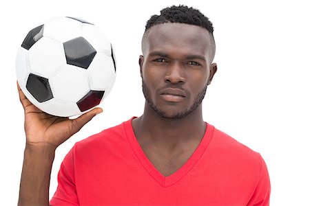 Portrait of a serious handsome football fan over white background Stock Photo - Budget Royalty-Free & Subscription, Code: 400-07750665