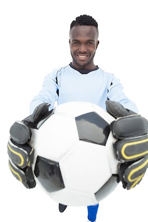 Portrait of a smiling handsome football player over white background Stock Photo - Budget Royalty-Free & Subscription, Code: 400-07750668