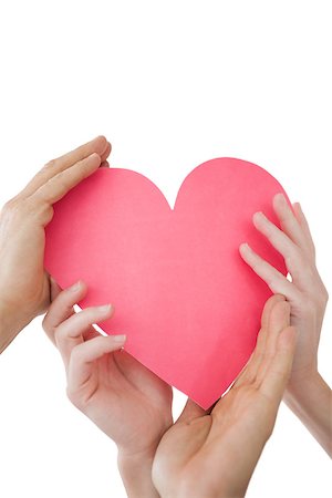 Close up of hands holding heart over white background Stock Photo - Budget Royalty-Free & Subscription, Code: 400-07750726