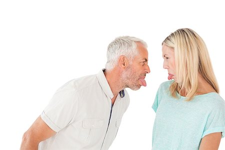 simsearch:400-07726578,k - Mature couple arguing with each other over white background Fotografie stock - Microstock e Abbonamento, Codice: 400-07750736