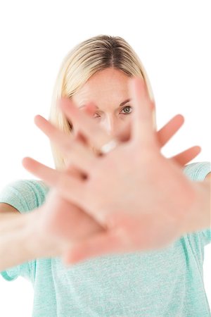 simsearch:400-06635276,k - Close up portrait of mature woman signals stop over white background Photographie de stock - Aubaine LD & Abonnement, Code: 400-07750737