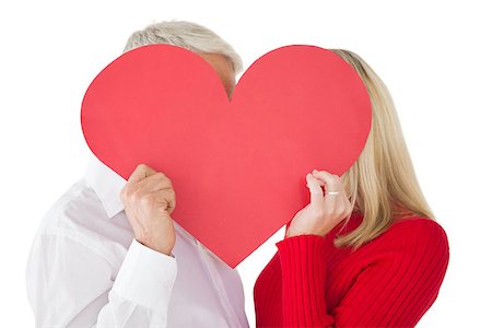 Mature couple holding heart over white background Stock Photo - Budget Royalty-Free & Subscription, Code: 400-07750730