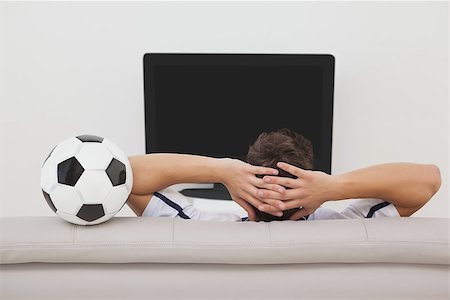 people watching football on tv - Rear view of a soccer fan watching tv Stock Photo - Budget Royalty-Free & Subscription, Code: 400-07750784