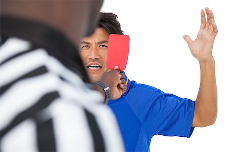 simsearch:622-08007327,k - Referee showing red card to football player over white background Photographie de stock - Aubaine LD & Abonnement, Code: 400-07750797