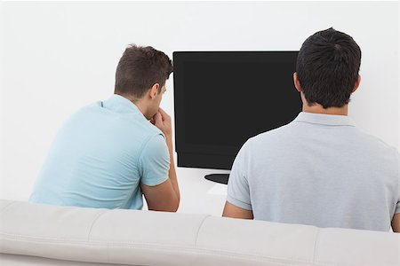 soccer home friends - Rear view of two soccer fans watching tv Stock Photo - Budget Royalty-Free & Subscription, Code: 400-07750792