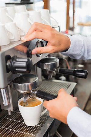 Barista making a cup of coffee at the coffee shop Stock Photo - Budget Royalty-Free & Subscription, Code: 400-07750826