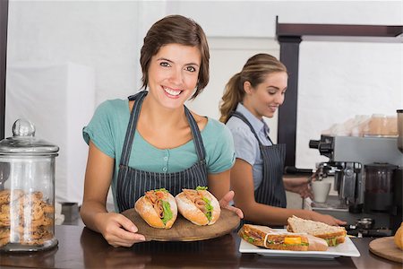 simsearch:400-06917365,k - Pretty waitresses working with a smile at the coffee shop Stock Photo - Budget Royalty-Free & Subscription, Code: 400-07750915