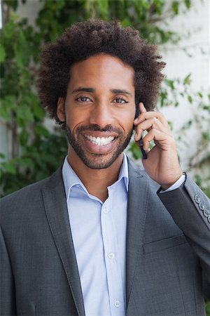 simsearch:400-07139155,k - Handsome businessman on the phone on a sunny day Stock Photo - Budget Royalty-Free & Subscription, Code: 400-07751284