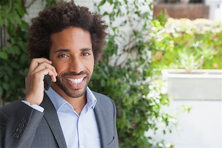 simsearch:400-07139155,k - Handsome businessman on the phone on a sunny day Stock Photo - Budget Royalty-Free & Subscription, Code: 400-07751288