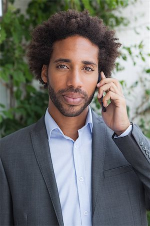 simsearch:400-07139155,k - Handsome businessman on the phone on a sunny day Stock Photo - Budget Royalty-Free & Subscription, Code: 400-07751283