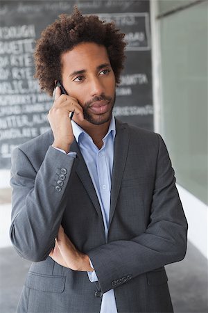 simsearch:400-07927298,k - Handsome businessman on the phone outside at the coffee shop Foto de stock - Royalty-Free Super Valor e Assinatura, Número: 400-07751295