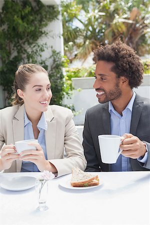 Happy business people on their lunch outside at the coffee shop Stock Photo - Budget Royalty-Free & Subscription, Code: 400-07751299