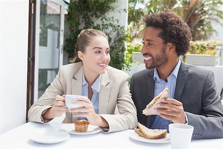 Happy business people on their lunch outside at the coffee shop Stock Photo - Budget Royalty-Free & Subscription, Code: 400-07751301