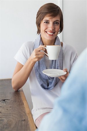 simsearch:622-07743554,k - Casual woman having a coffee with friend at the coffee shop Stock Photo - Budget Royalty-Free & Subscription, Code: 400-07751320