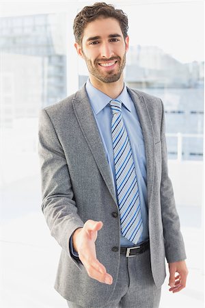 simsearch:400-05748158,k - Businessman offering to shake hands at work Stock Photo - Budget Royalty-Free & Subscription, Code: 400-07751619