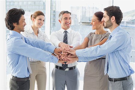 pile hands bussiness - Employee's smiling and having fun while stacking hands together Stock Photo - Budget Royalty-Free & Subscription, Code: 400-07751694