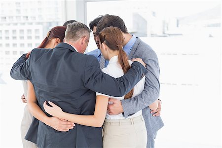 Business team all huddled together in a circle Stock Photo - Budget Royalty-Free & Subscription, Code: 400-07751873