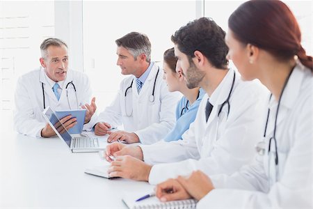simsearch:640-03257612,k - Doctors having a medical discussion in a meeting room Stock Photo - Budget Royalty-Free & Subscription, Code: 400-07752049