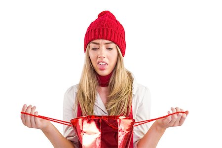 Disappointed blonde opening gift bag on white background Stock Photo - Budget Royalty-Free & Subscription, Code: 400-07752484