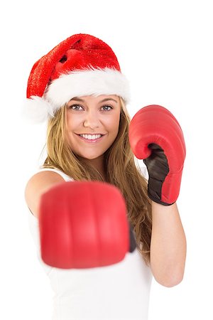 Festive blonde punching with boxing gloves on white background Photographie de stock - Aubaine LD & Abonnement, Code: 400-07752575