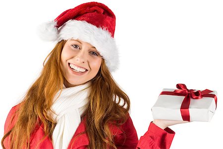 Festive redhead holding a gift on white background Stock Photo - Budget Royalty-Free & Subscription, Code: 400-07752761