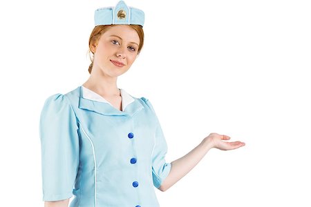 simsearch:400-07752842,k - Pretty air hostess presenting with hand on white background Stock Photo - Budget Royalty-Free & Subscription, Code: 400-07752844