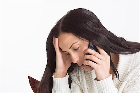 phone with pain - Woman suffering from a migrane on white background Stock Photo - Budget Royalty-Free & Subscription, Code: 400-07753016