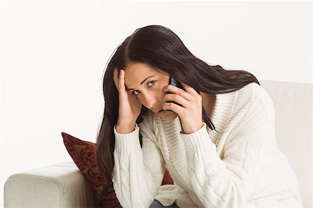 phone with pain - Woman on a bad call on white background Stock Photo - Budget Royalty-Free & Subscription, Code: 400-07753018