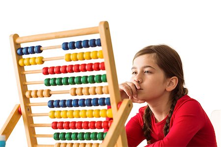 Cute little girl using an abacus on white background Stock Photo - Budget Royalty-Free & Subscription, Code: 400-07753113