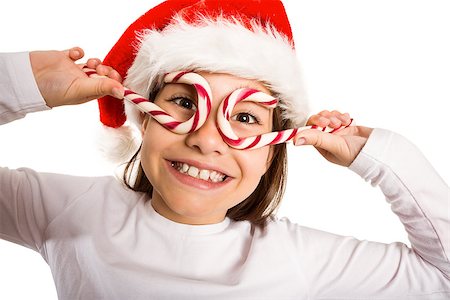 Festive little girl smiling at camera on white background Photographie de stock - Aubaine LD & Abonnement, Code: 400-07753125