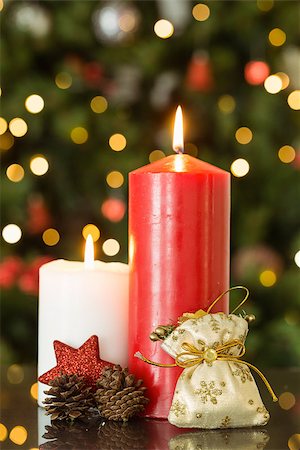 pinecones and ribbons - Focus on christmas candles and decorations at home in the living room Stock Photo - Budget Royalty-Free & Subscription, Code: 400-07753211