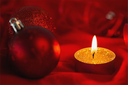 Golden tea light candle with christmas decorations on red surface Stock Photo - Budget Royalty-Free & Subscription, Code: 400-07753252