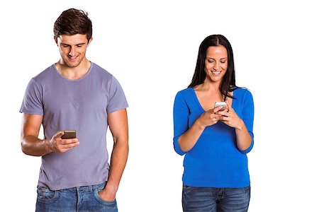 Young couple sending a text on white background Stock Photo - Budget Royalty-Free & Subscription, Code: 400-07753307
