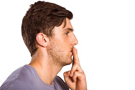 Young man with finger on lips on white background Stock Photo - Budget Royalty-Free & Subscription, Code: 400-07753375