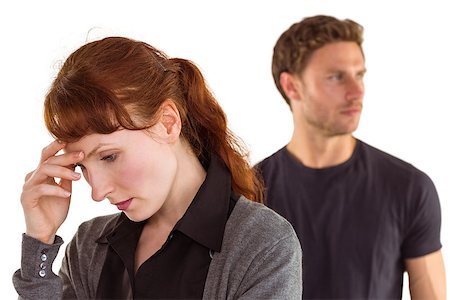 simsearch:400-07833287,k - Worried woman with man behind on white background Stock Photo - Budget Royalty-Free & Subscription, Code: 400-07753564