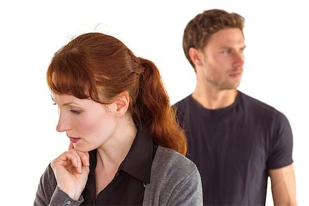 simsearch:400-07833287,k - Worried woman with man behind on white background Fotografie stock - Microstock e Abbonamento, Codice: 400-07753563