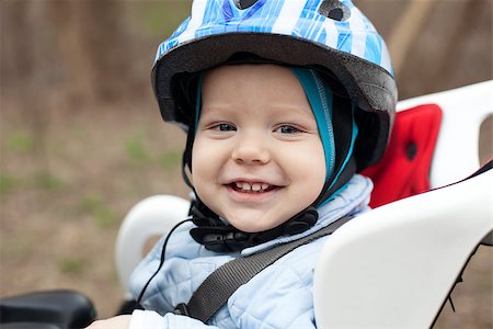 Little boy in bicycle seat Stock Photo - Budget Royalty-Free & Subscription, Code: 400-07769924