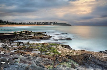 simsearch:400-07667033,k - North view overlooking coast and rock pool at South Curl Curl. Australia.  Motion in water, clouds and railings Stock Photo - Budget Royalty-Free & Subscription, Code: 400-07774035
