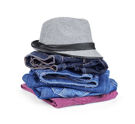 simsearch:400-07919690,k - stack of jeans with a hat on an isolated white background Stockbilder - Microstock & Abonnement, Bildnummer: 400-07774145