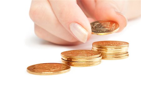 piles of cash pounds - Hand put coins to stack of coins on white background Stock Photo - Budget Royalty-Free & Subscription, Code: 400-07774265